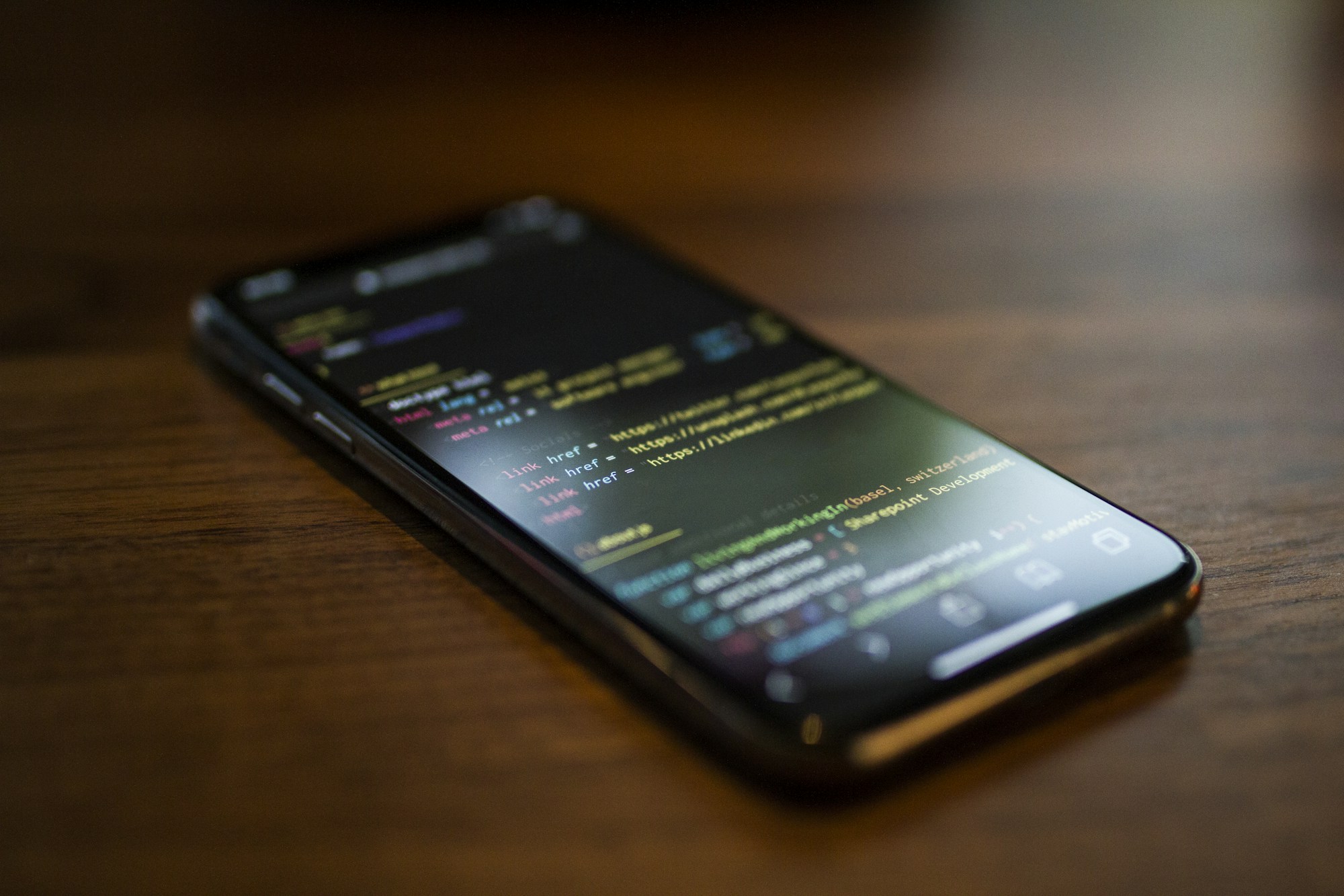 Smartphone displaying a web app on a desk