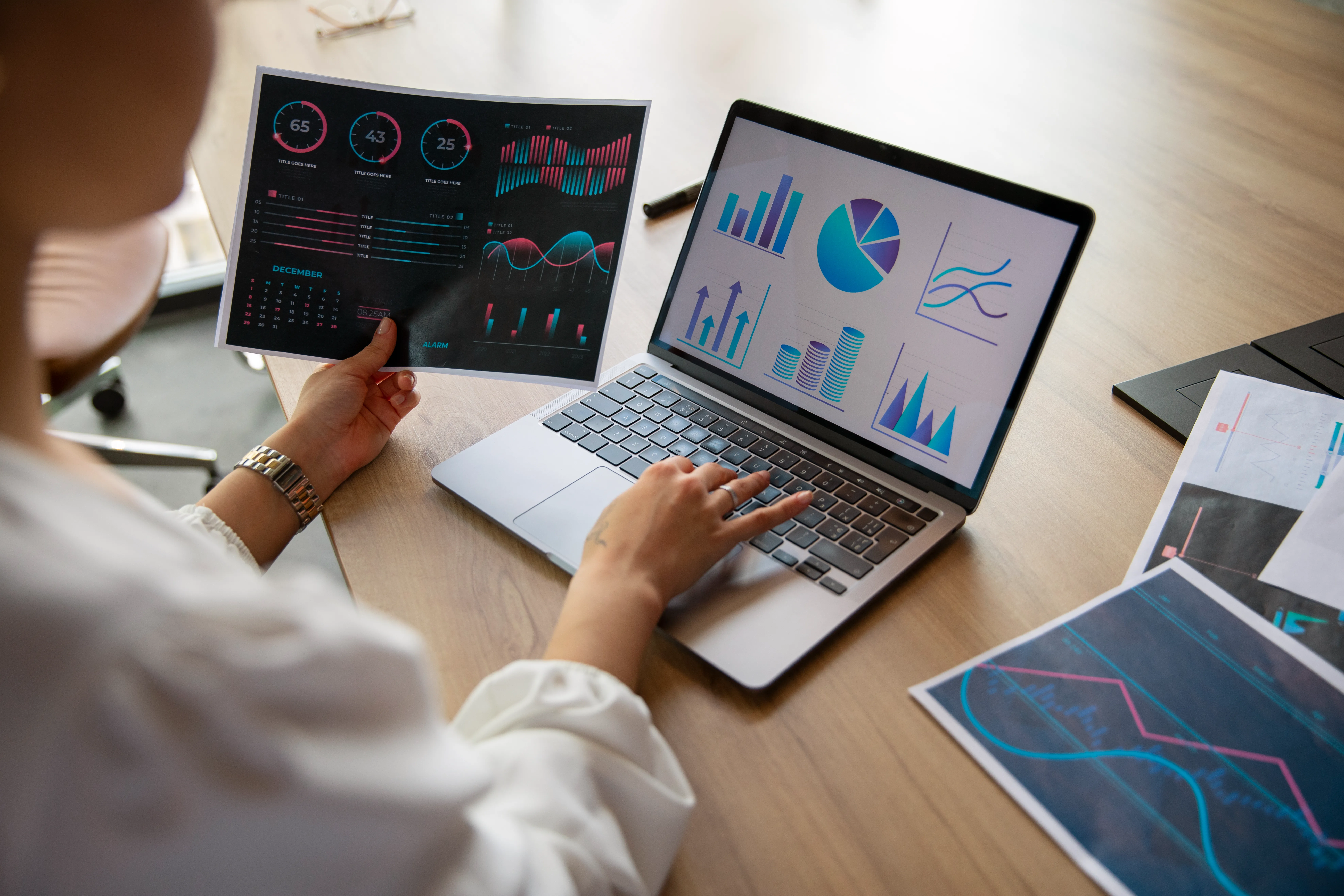 Office workers using finance graphs