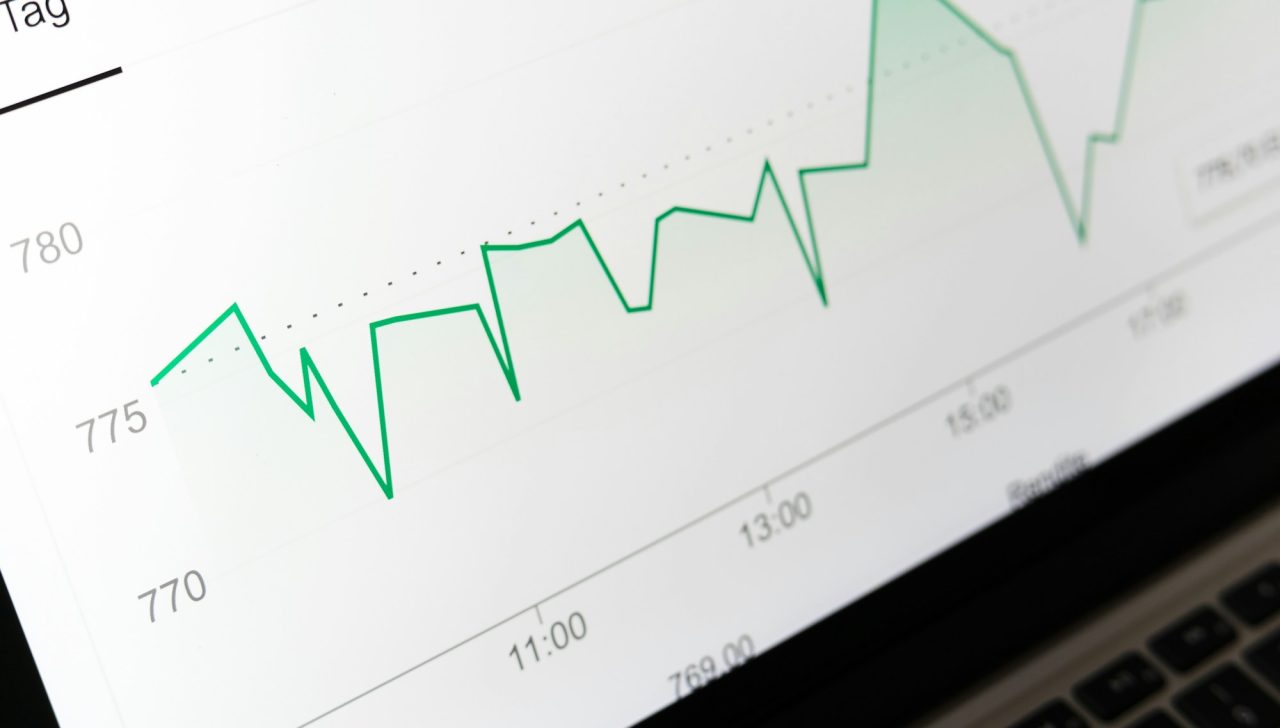 Performance line chart displayed on a laptop screen
